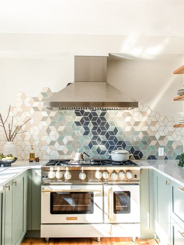 Sage green U-shaped kitchen with shaker lower cabinets and no upper cabinets
